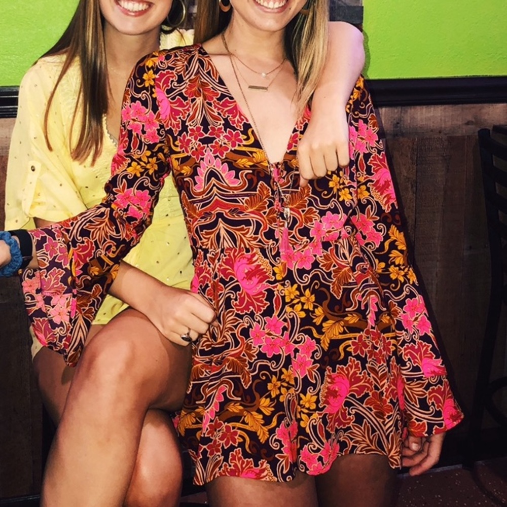 GB Long Sleeve Floral Romper with Plunging V-Neck!